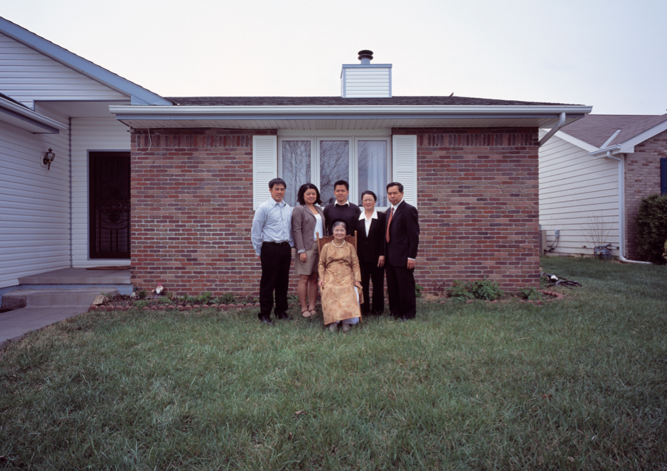 Binh Danh's photo of Mary Nguyen's family in front of home, 2011. Archival pigmented print.