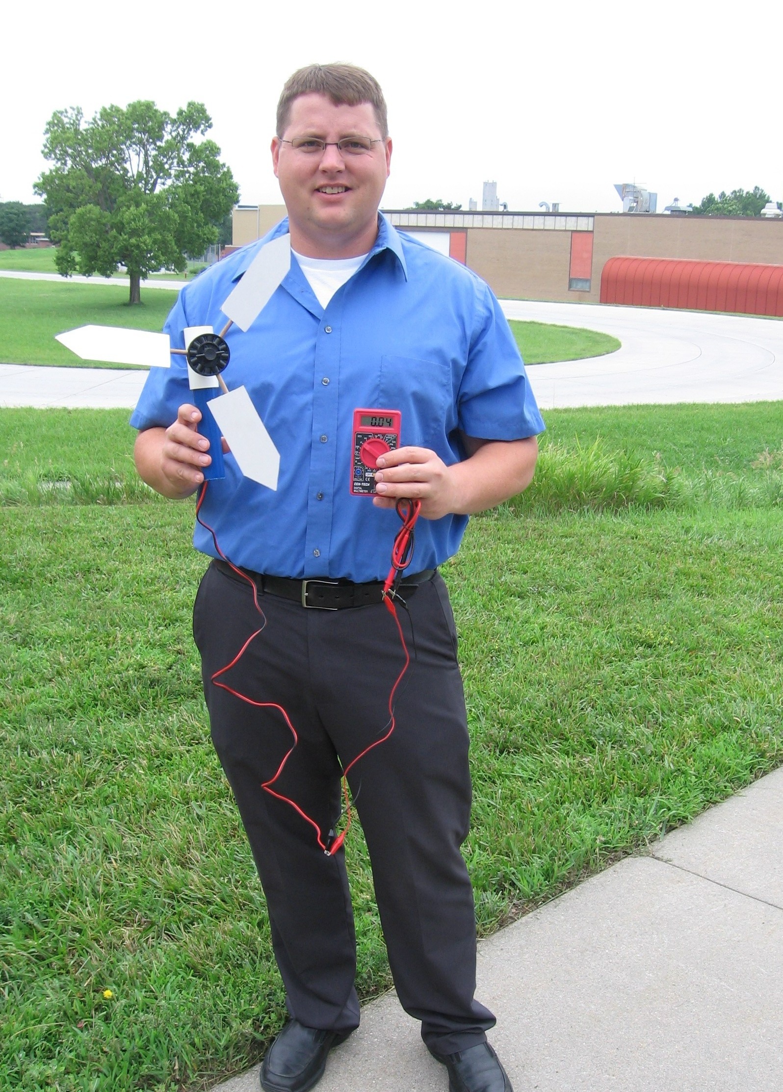 John Hay shows the simple parts to be used by youth to create a wind turbine.