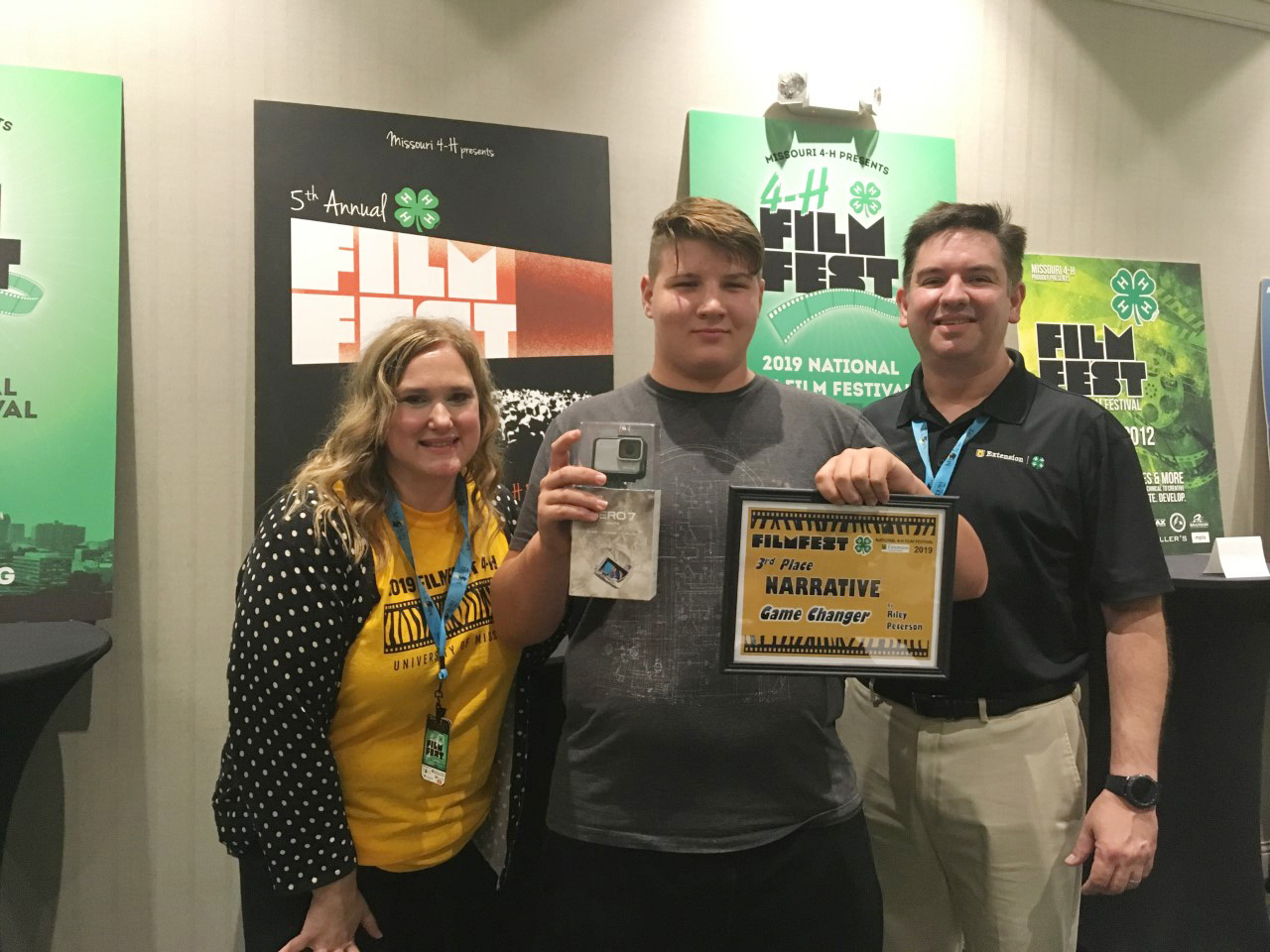 Riley Peterson (center) earned 3rd place for his narrative video, “Game Changers.”