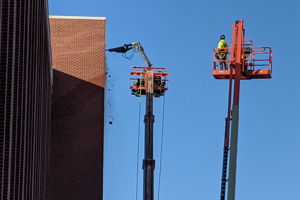 A robotic pneumatic jackhammer is used Jan. 7 for demolition of a stairwell on the north side of Scott Engineering Center.