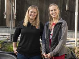 Alexa Davis, (right) graduate student with the School of Natural Resources, and Tiffany Messer, assistant professor and water quality engineer at the University of Nebraska-Lincoln, in the Messer Laboratory surrounded by floating wetland experiments on De