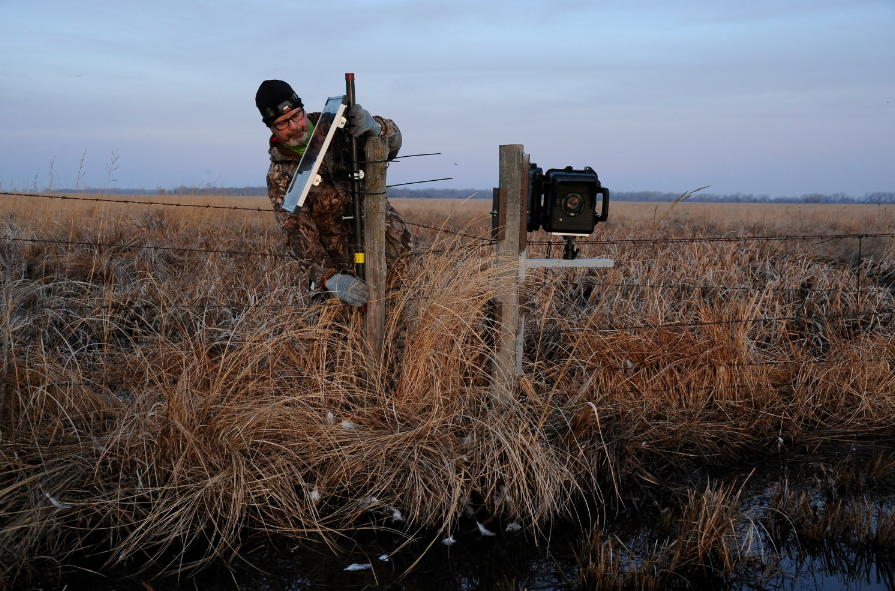 Bill Hager installs a time-lapse camera at the Mormon Island Recreation Center near Grand Island.