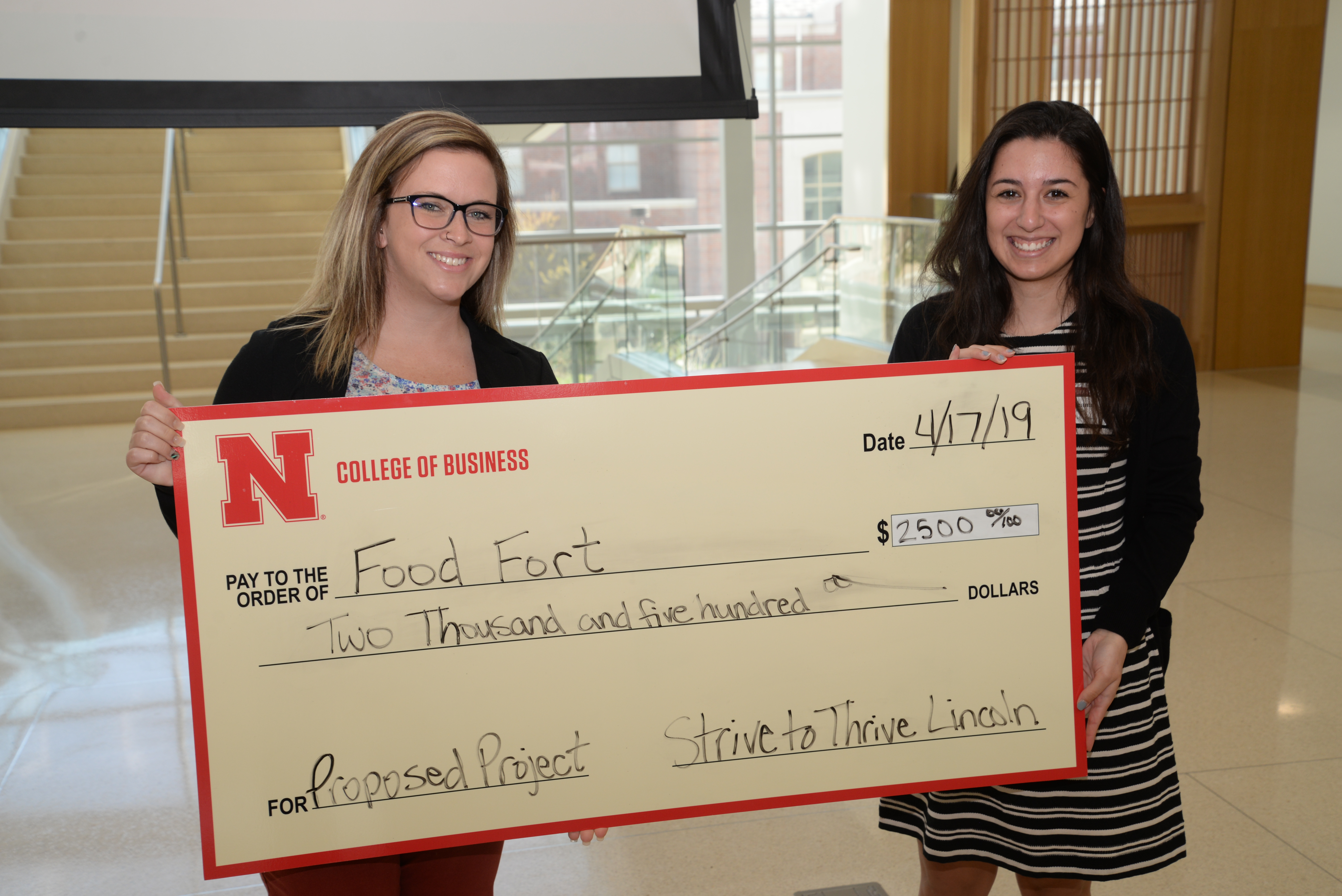 Food Fort Founder Michaela Akridge accepts a Strive to Thrive Lincoln grant