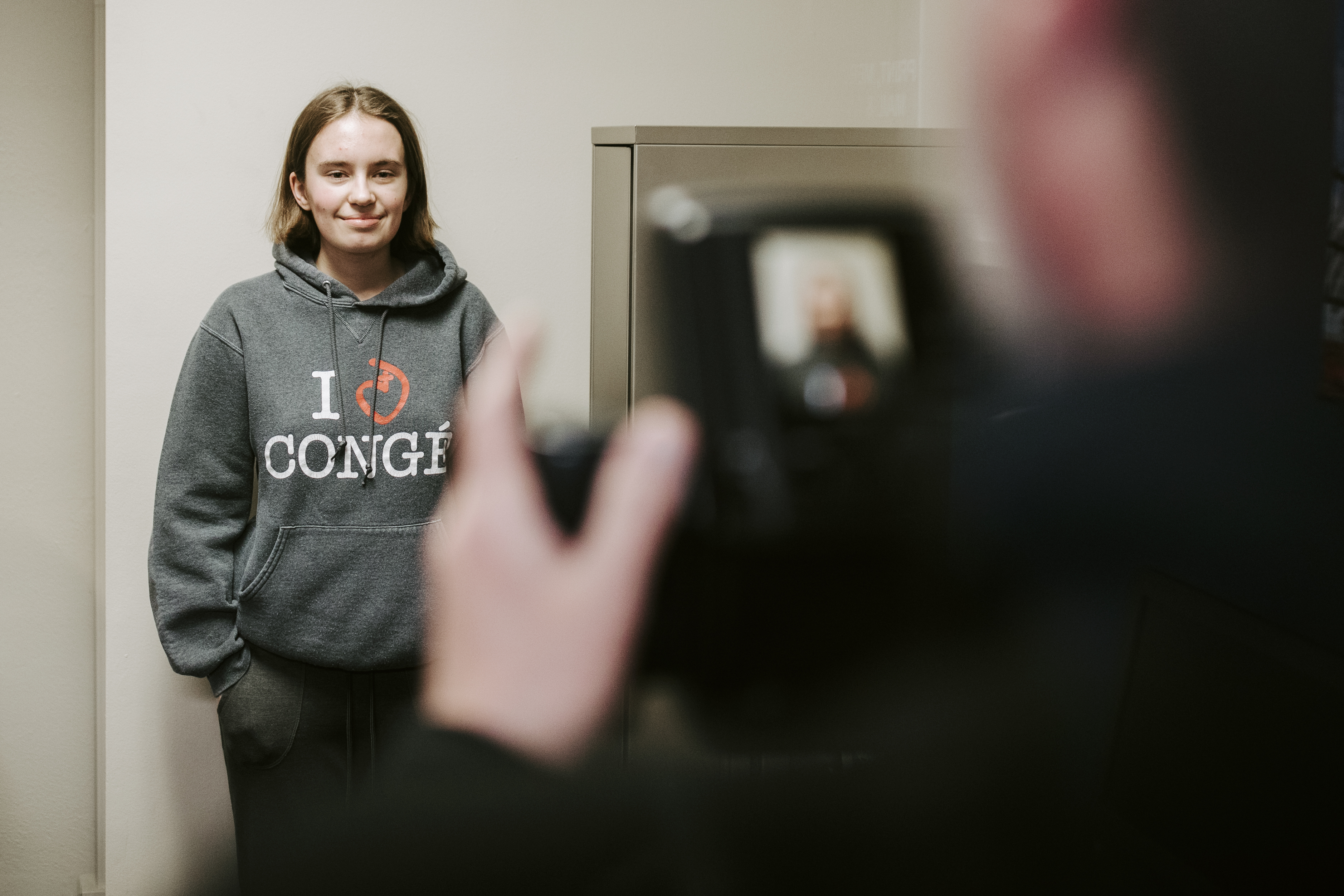 Freshman Grace Gawecki poses for her application photo at the UNL Passport Office. Gawecki was one of 88 UNL students who applied for a passport through the Husker Passport Giveaway.