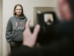 Freshman Grace Gawecki poses for her application photo at the UNL Passport Office. Gawecki was one of 88 UNL students who won the Husker Passport Giveaway in 2019.