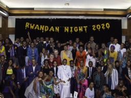 Chancellor Ronnie Green and the Ambassador of Rwanda Mathilde Mukantabana pose with Rwandan students at the end of the first Rwanda Night celebration. Credit: University Communication.