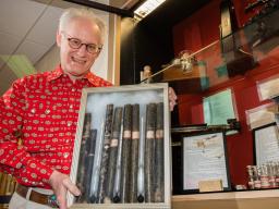 Mark Griep, professor of chemistry, holds the saccharometers Rachel Lloyd used in the late 19th century to study sugar beets grown in Nebraska. Lloyd's research helped establish a sugar beet industry in the state, providing economic development. Greg Nath