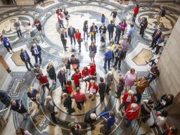 University of Nebraska students, supporters and alumni talk to state senators in the Rotunda Gallery during "I Love NU" Advocacy Day 2019 at the Nebraska State Capitol.