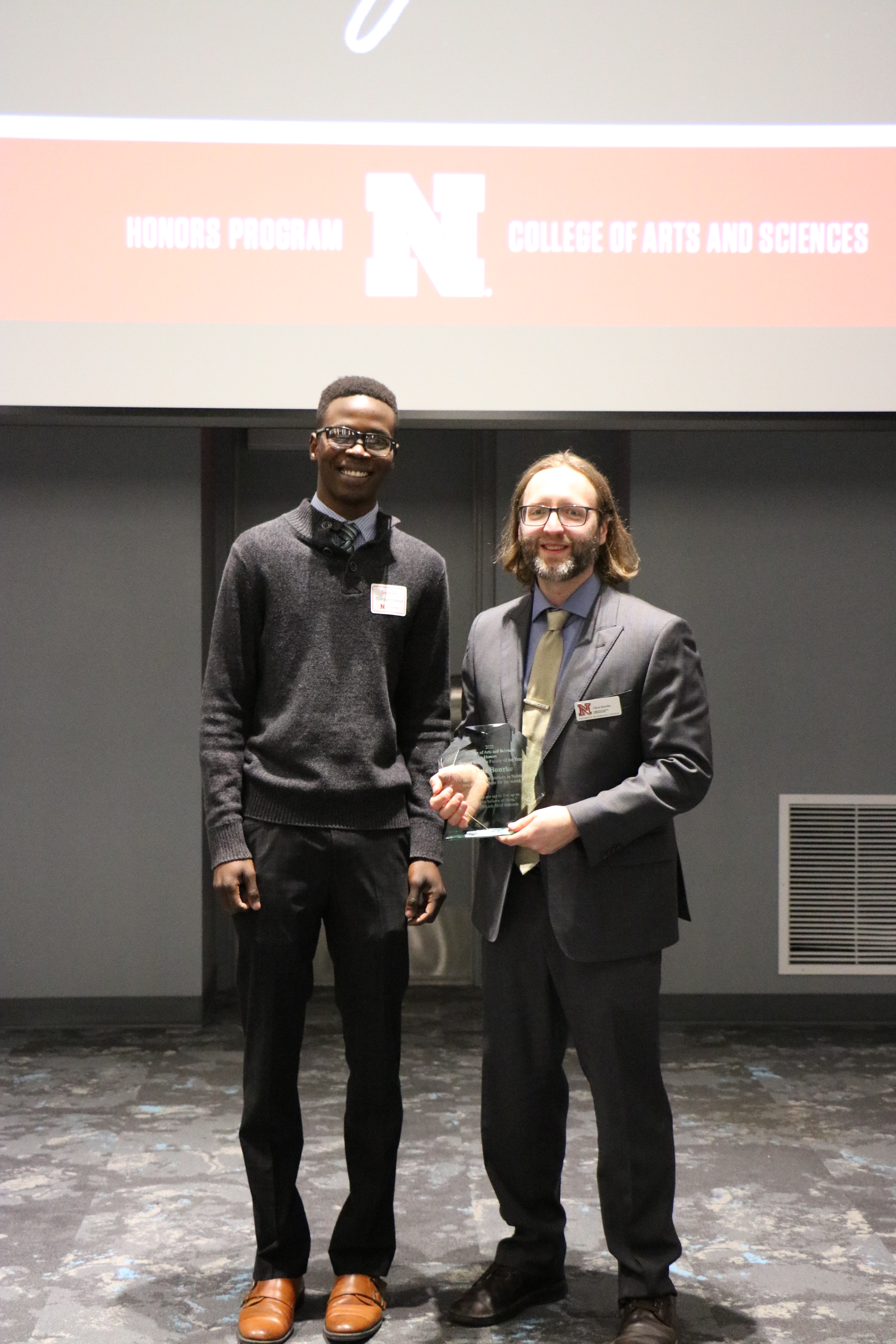 Chris Bourke accepting his award at yesterday's CAS Honors ceremony with student speaker Salman Djingueinabaye.