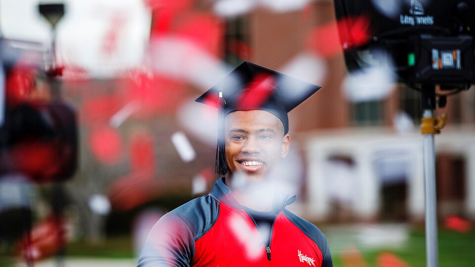 Ramarro Lamar, a graduating senior, is filmed opening confetti included in the Go Big Grad celebration boxes. Lamar was featured in the televised graduation celebration May 9.
