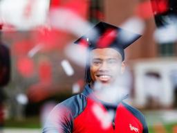 Ramarro Lamar, a graduating senior, is filmed opening confetti included in the Go Big Grad celebration boxes. Lamar was featured in the televised graduation celebration May 9.