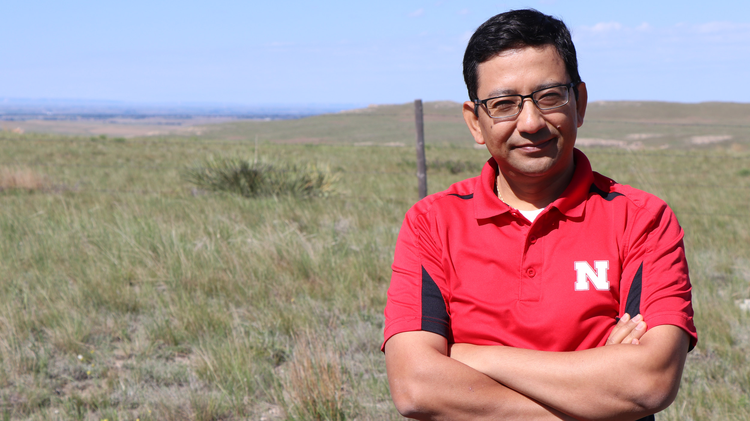 Bijesh Maharjan stands near a pasture north of Scottsbluff, Nebraska. David Ostdiek | Communications Specialist Panhandle REC