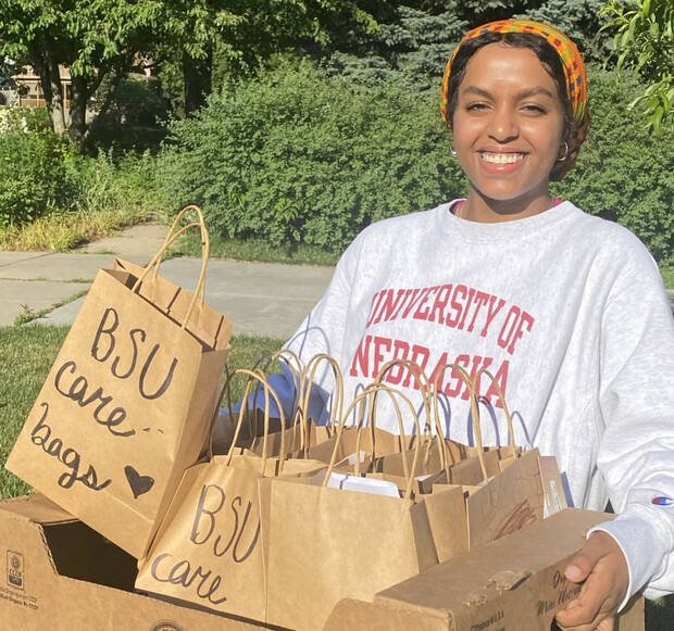 Batool Ibrahim smiles as she carries Black Student Union Care Bags that were distributed to community members in need. The project continues to seek donations. 