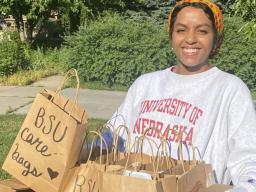 Batool Ibrahim smiles as she carries Black Student Union Care Bags that were distributed to community members in need. The project continues to seek donations. 