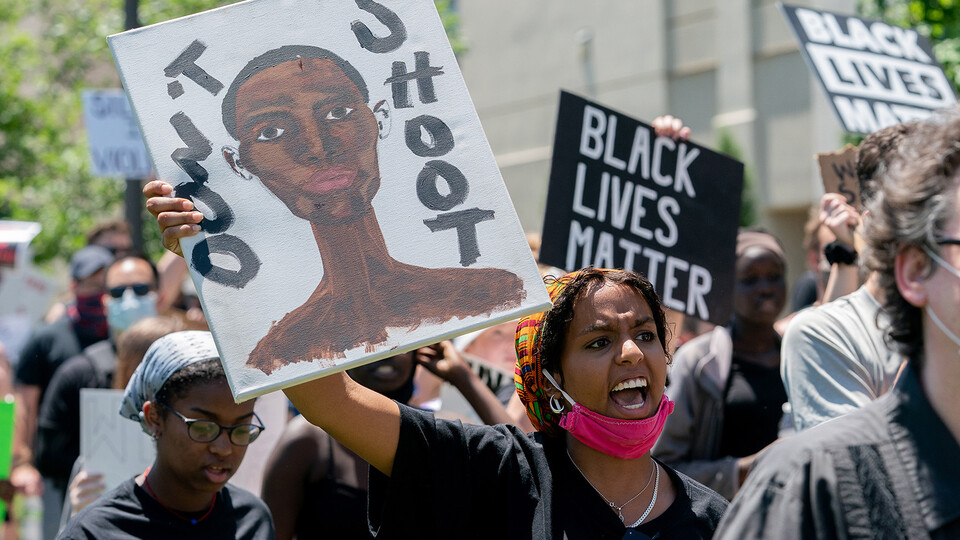 Batool Ibrahim, a member of the Black Student Union, leads protestors in chants as they march from the Nebraska State Capitol to Andersen Hall on June 13. 