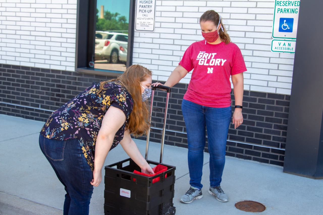 Husker Pantry staff and volunteers continue their efforts to meet the food and hygiene needs of UNL students with a curbside pick-up option.