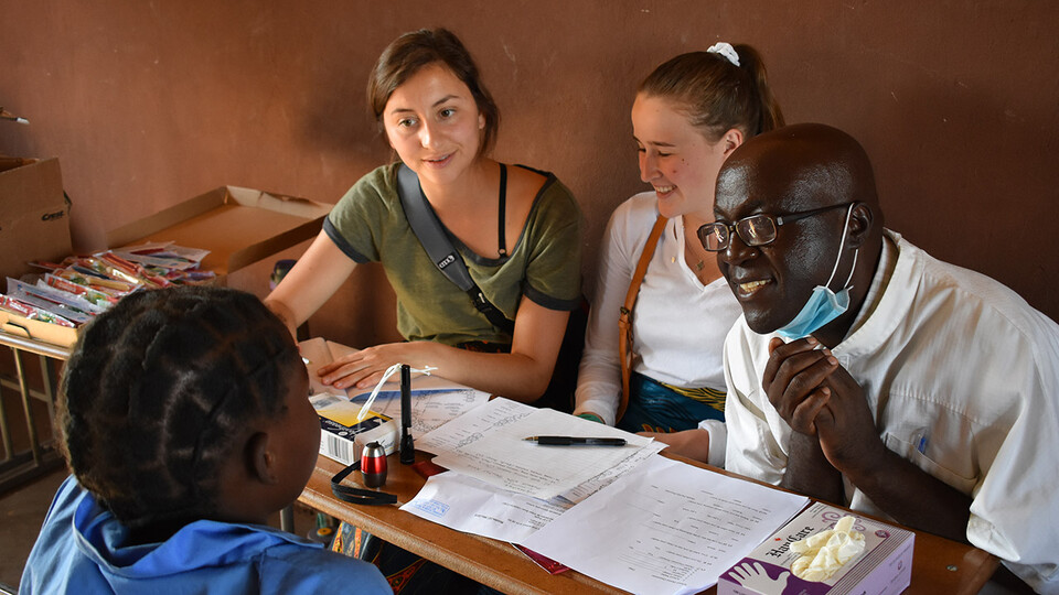 Two University of Nebraska–Lincoln students sit in on a local meeting during their “Food Security, Health and Nutrition” program in Zambia and Ethiopia in summer 2019. Led by Mary Willis, the study abroad program has included 15 Husker Gilman Scholars sin