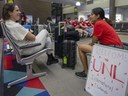UNL student workers greet newly arrived international students at the Lincoln airport last year. Credits: Troy Fedderson | University Communication