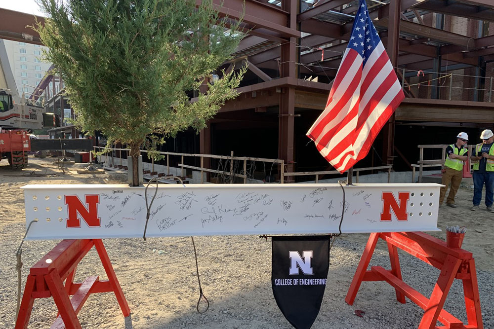 After many signatures were inscribed on the final steal beam, it was raised into place during Wednesday's Topping Out ceremony Phase 1 of the college's construction project.