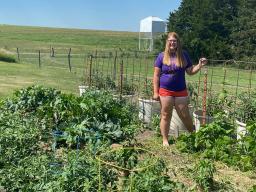 The Biggest Grower participant Shauna Radant of Team Kohlrabi shows off her competition garden near Valentine, Nebraska, this summer.