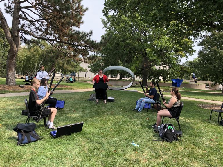 Graduate Teaching Assistant Natalie Francel-Stone and Assistant Professor of Bassoon and Music Theory Nathan Koch lead an instrument skills class in the Arts Quad at the University of Nebraska-Lincoln. 
