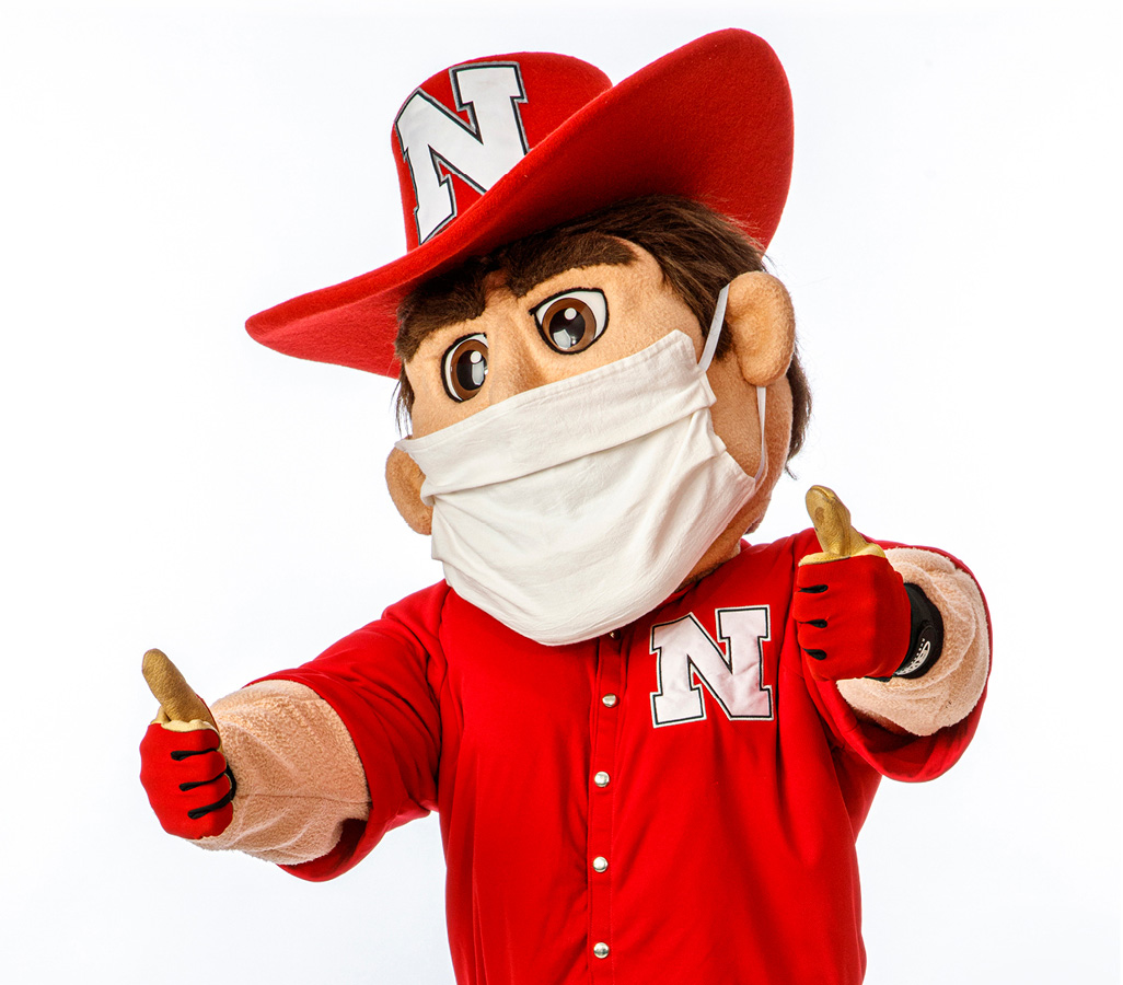 Herbie Husker with Mask and Thumbs Up.jpg