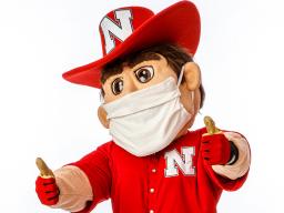 Herbie Husker with Mask and Thumbs Up.jpg