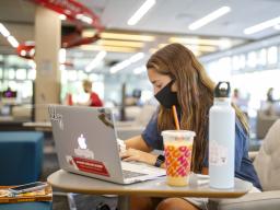 Student in the Adele Hall Learning Commons