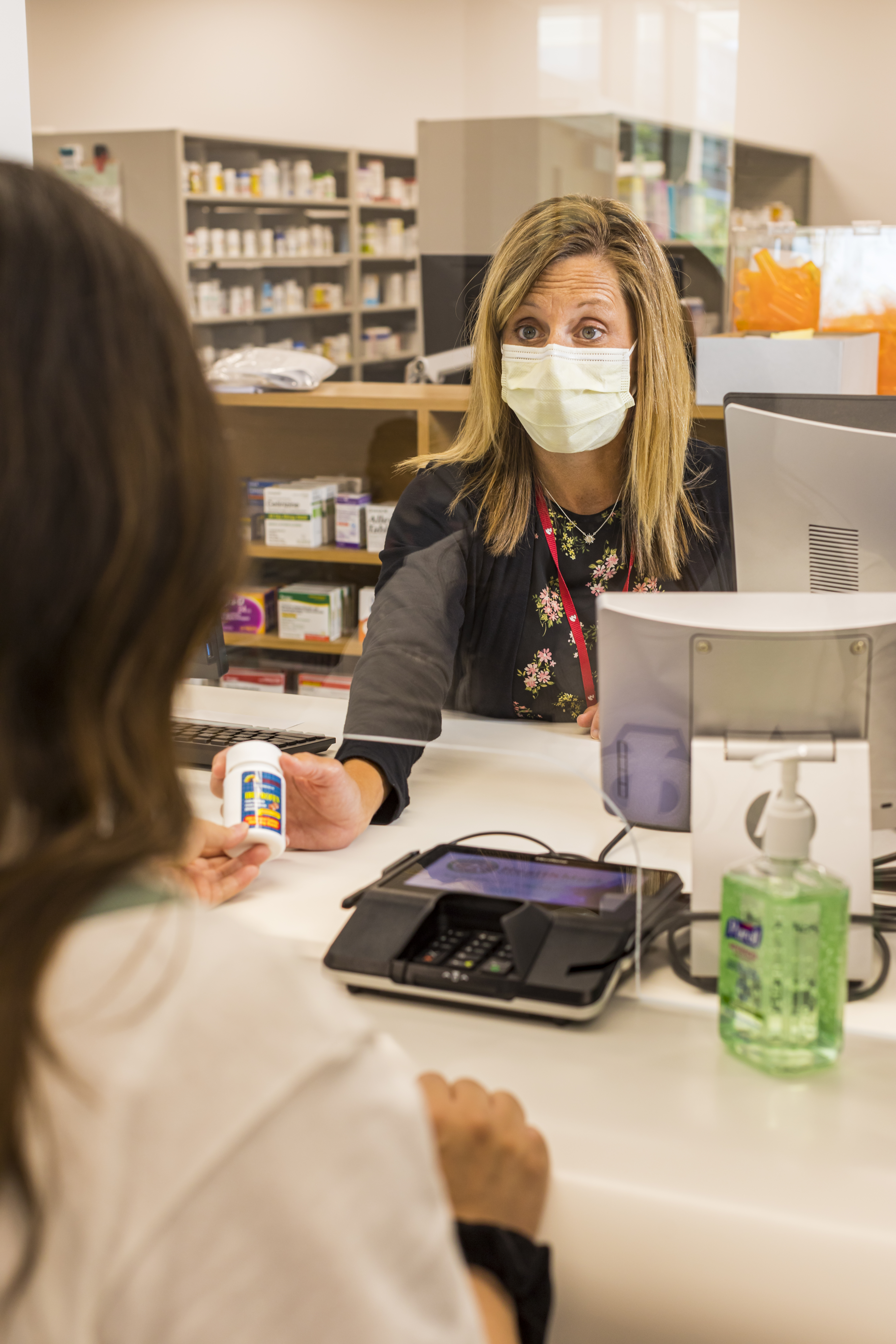 Student purchases an over-the-counter product from a pharmacy team member.