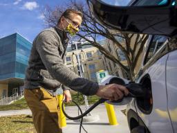 Dan Carpenter, director of Parking and Transit Services, plugs in a Chevy Bolt at a new charging station in front of Howard L. Hawks Hall. The University of Nebraska–Lincoln has six new charging stations for electric vehicles across City and East Campus.