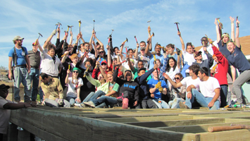 Students pose for a photo during a previous service learning trip.