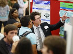 Student presenting research at the Nebraska Summer Research Symposium