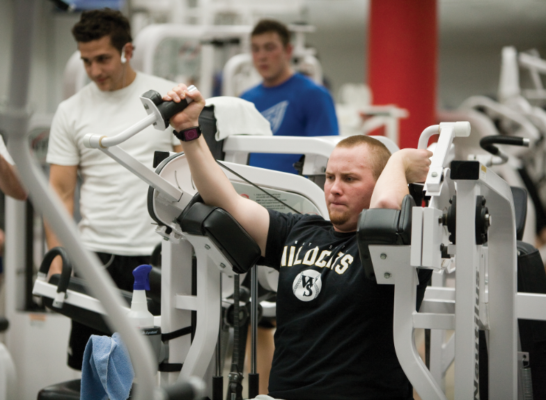 A student exercises in Campus Rec Center. Photo by Craig Chandler, University Communications