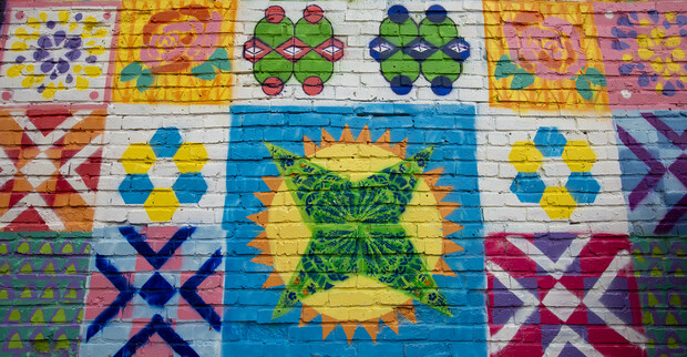Detail of the mural students created in Lincoln's historic Havelock neighborhood on April 17. Each block is two-feet square. Photo by Troy Fedderson.