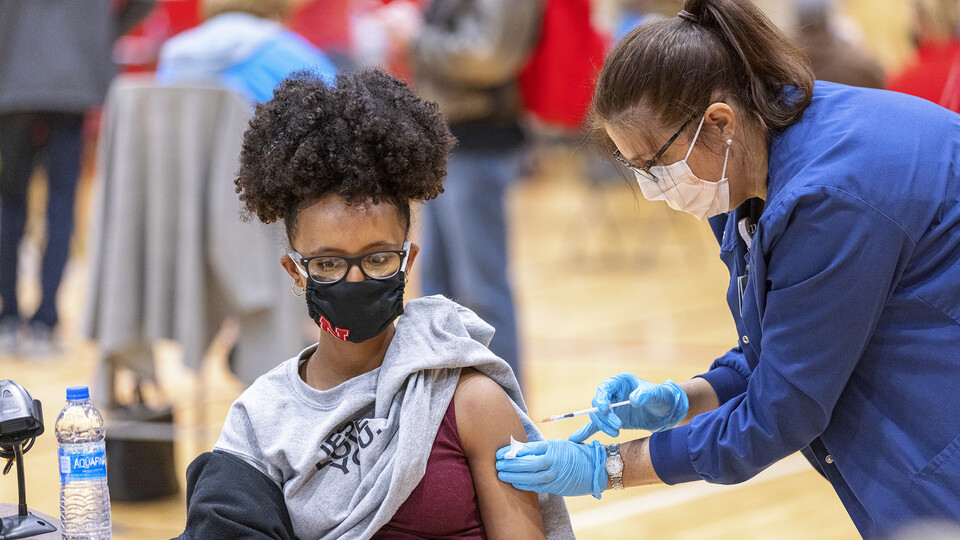 Meklit Aga receives her first dose of vaccine during a COVID-19 vaccination clinic April 20 at the Coliseum.