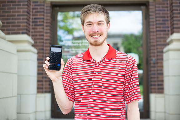 Adam Zastrow with his maRemote app, which gives remote access to the grandMA2 lighting console. Photo by Eddy Aldana.