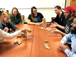 CRE students number the blocks in the game Jenga and play it with special rules to teach resilience concepts. Pictured are (from left) Julie Fowler, Jessica Johnson, Alison Ludwig, Rubi Quiñones, Conor Barnes, Dominic Cristiano and Daniel Morales.