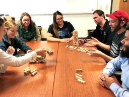 CRE students number the blocks in the game Jenga and play it with special rules to teach resilience concepts. Pictured are (from left) Julie Fowler, Jessica Johnson, Alison Ludwig, Rubi Quiñones, Conor Barnes, Dominic Cristiano and Daniel Morales.