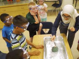 Nora Husein of Lincoln conducts a science experiment during her after-school club in 2019.