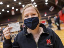 Nebraska's Whitney Steckel displays her vaccine card after getting her first inoculation during an on-campus clinic on April 20. [Craig Chandler | University Communication]