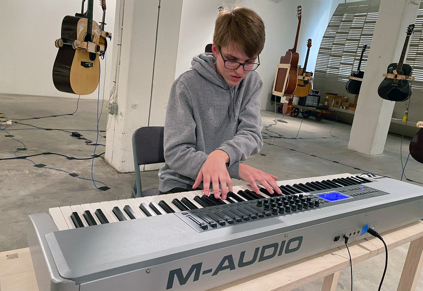 Luke Farritor plays the "Soundtracks for the Present Future" keyboard in the Bemis Center. Farritor is a sophomore in Nebraska's Jeffrey S. Raikes School of Computer Science and Management.