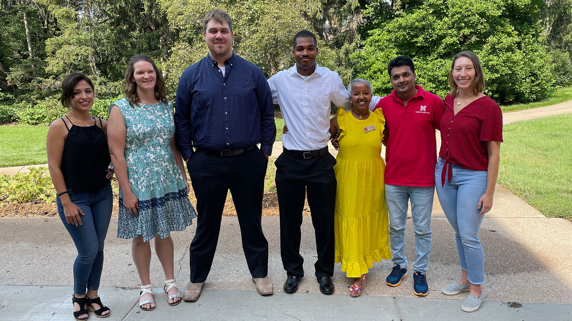 Agronomy and Horticulture Department Head Martha Mamo (third from right) celebrates with Elnazsadat Hosseinighdam (from left), Lindsey Overmyer, Shawn McDonald, Kailon Lang, Dinesh Panday and Jasmine Mausbach at the department graduation reception Aug. 13