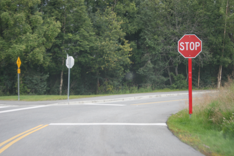 Retroreflective panels on stop sign posts increase visibility at night. Image from Iowa Center for Transportation Research and Education