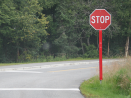 Retroreflective panels on stop sign posts increase visibility at night. Image from Iowa Center for Transportation Research and Education