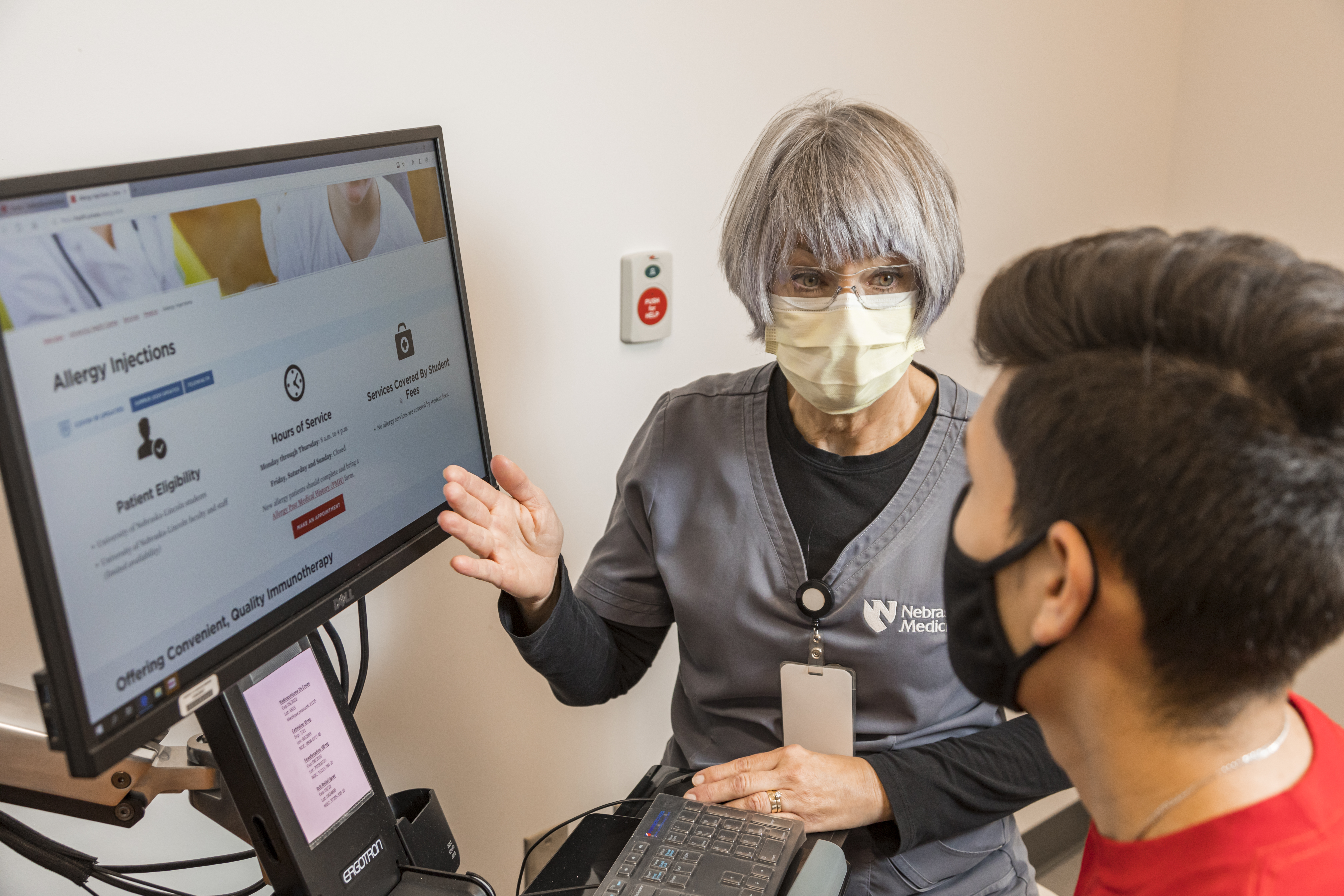 A health center nurse talks to a student during their appointment.