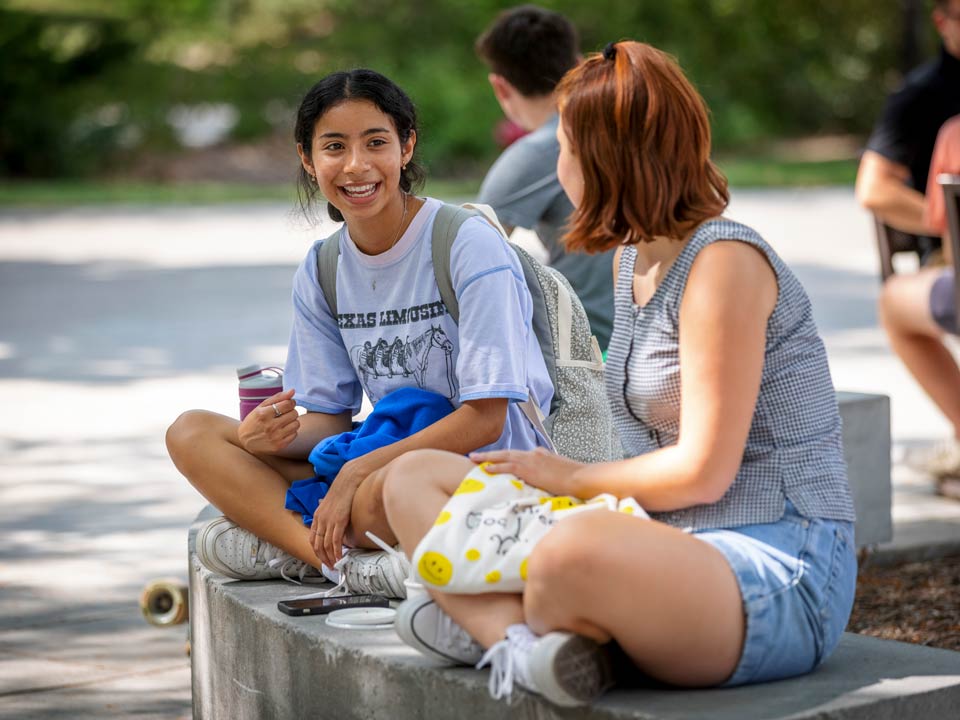 Mency Orellana and Rayni Wekluk hang out near the Nebraska Union during the Soph S'more Social, a new event designed to celebrate second-year students.