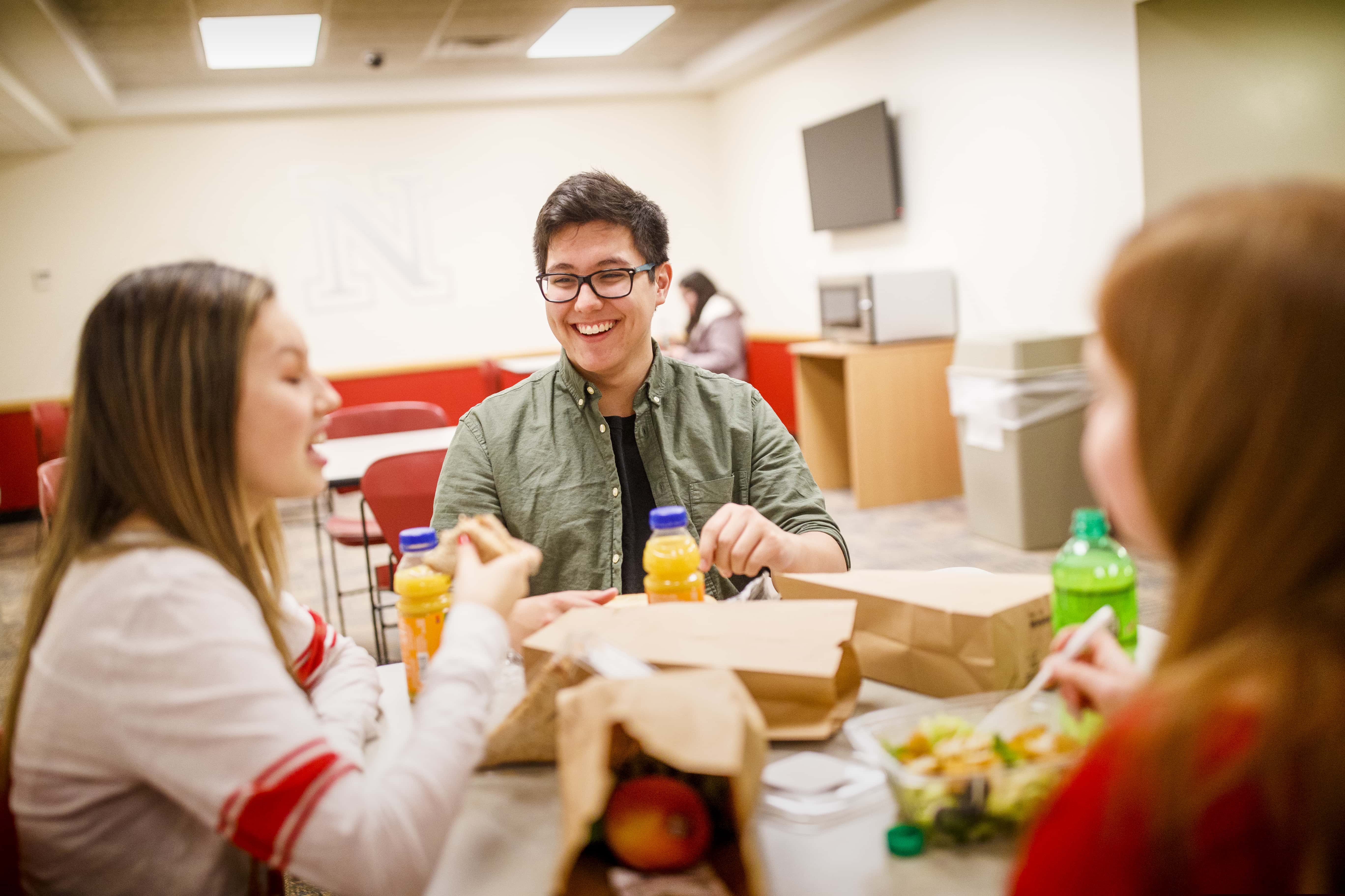 Students enjoy a to-go meal from Husker Heroes