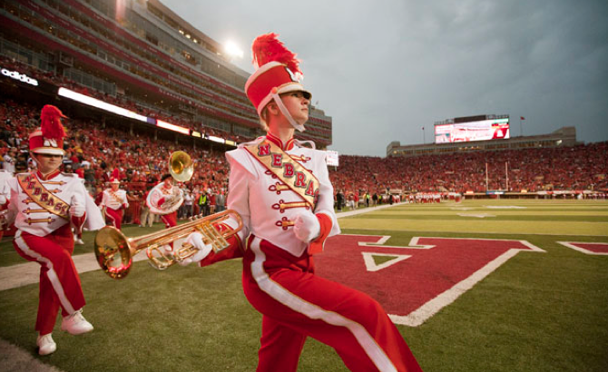 Members of the Cornhusker Marching Band take the field during the 2011 homecoming game with Ohio State. Photo by Craig Chandler, University Communications