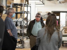 Mark Dion (center) and graduate students from the School of Art, Art History & Design tour Morrill Hall's Research Collections. Photo by Eddy Aldana.