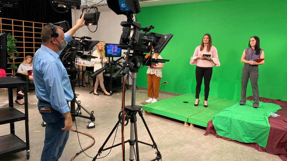 Anchors Kloee Sander, left, and Hallie Gutzwiller prepare for the "Nebraska Nightly" show open.